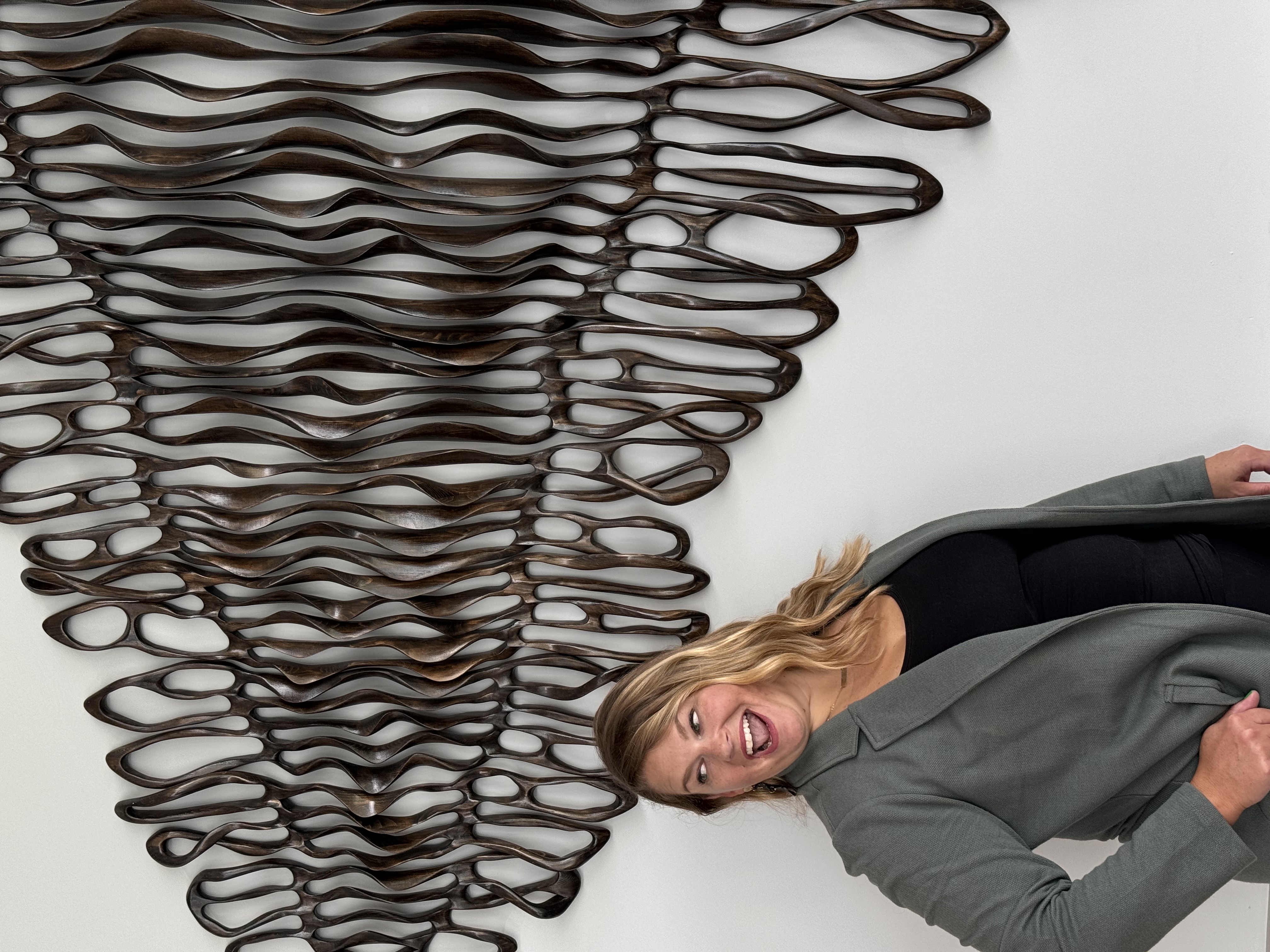 Photo of Lynn Marie Debilzen, founder of The Collective Shift Co., smiling and making a fun face