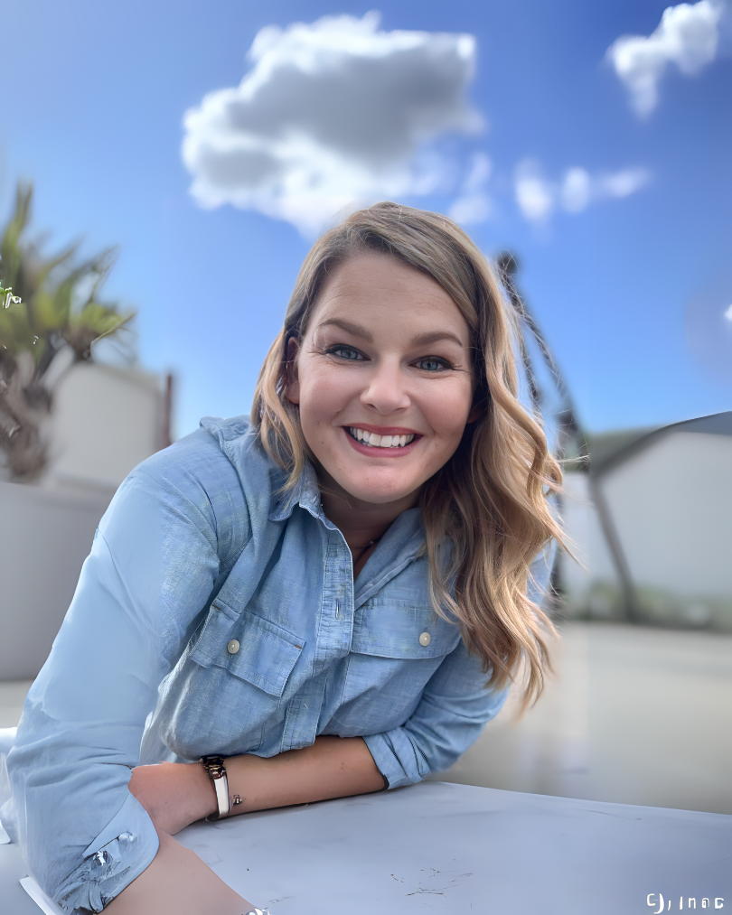 Photo of Lynn Marie Debilzen, founder of The Collective Shift Co., smiling and outside